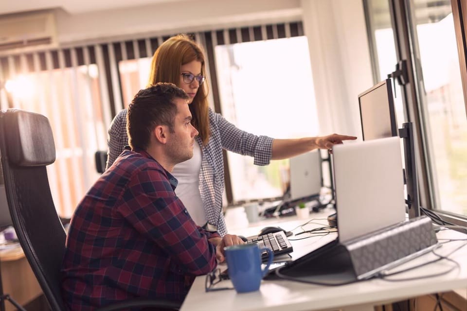 visual data cloud colleagues working together on a computer